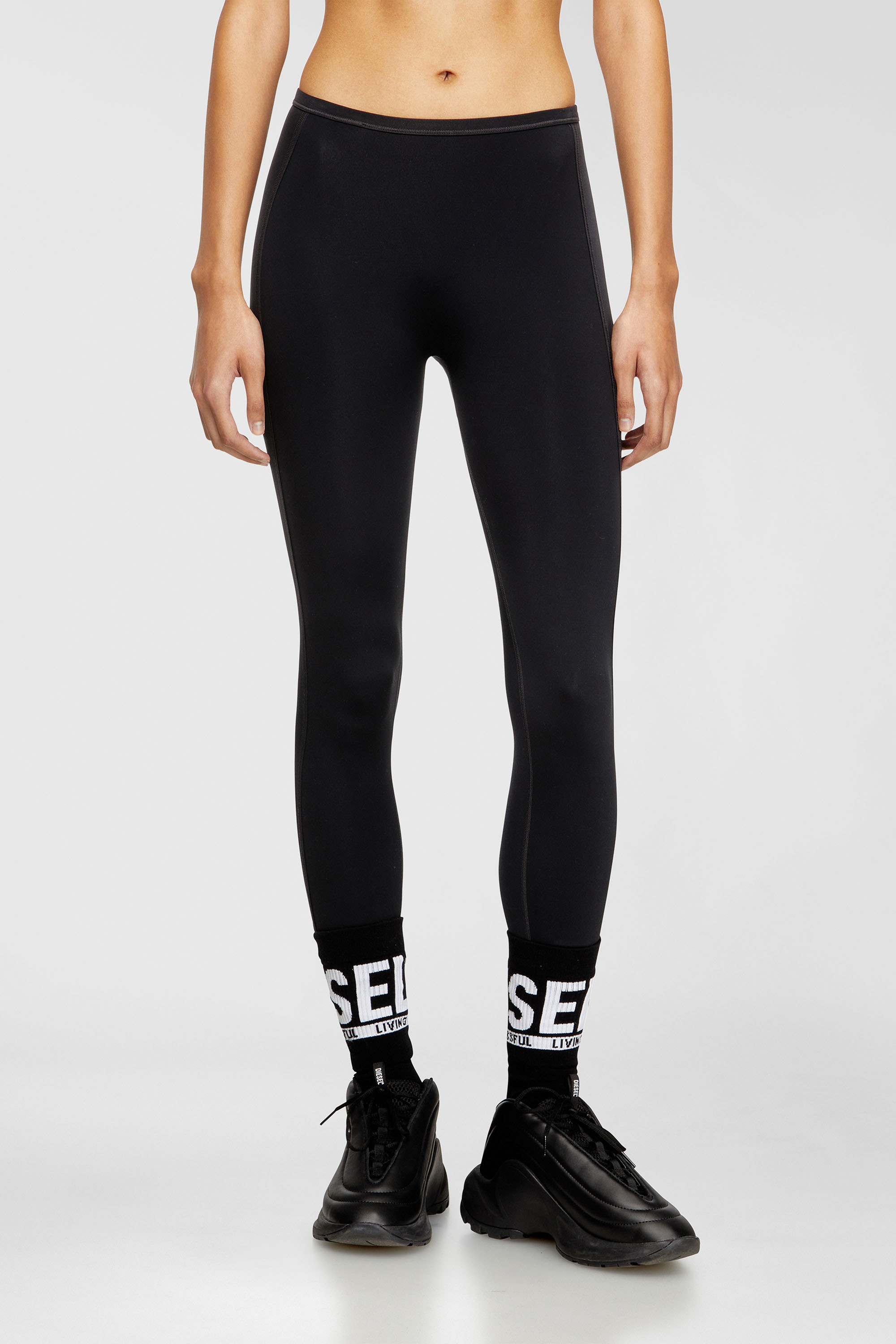 Diesel - MEREDITH-UTLT, Leggings en nylon &agrave; dos d&eacute;coup&eacute; Oval D Femme in Noir - 2