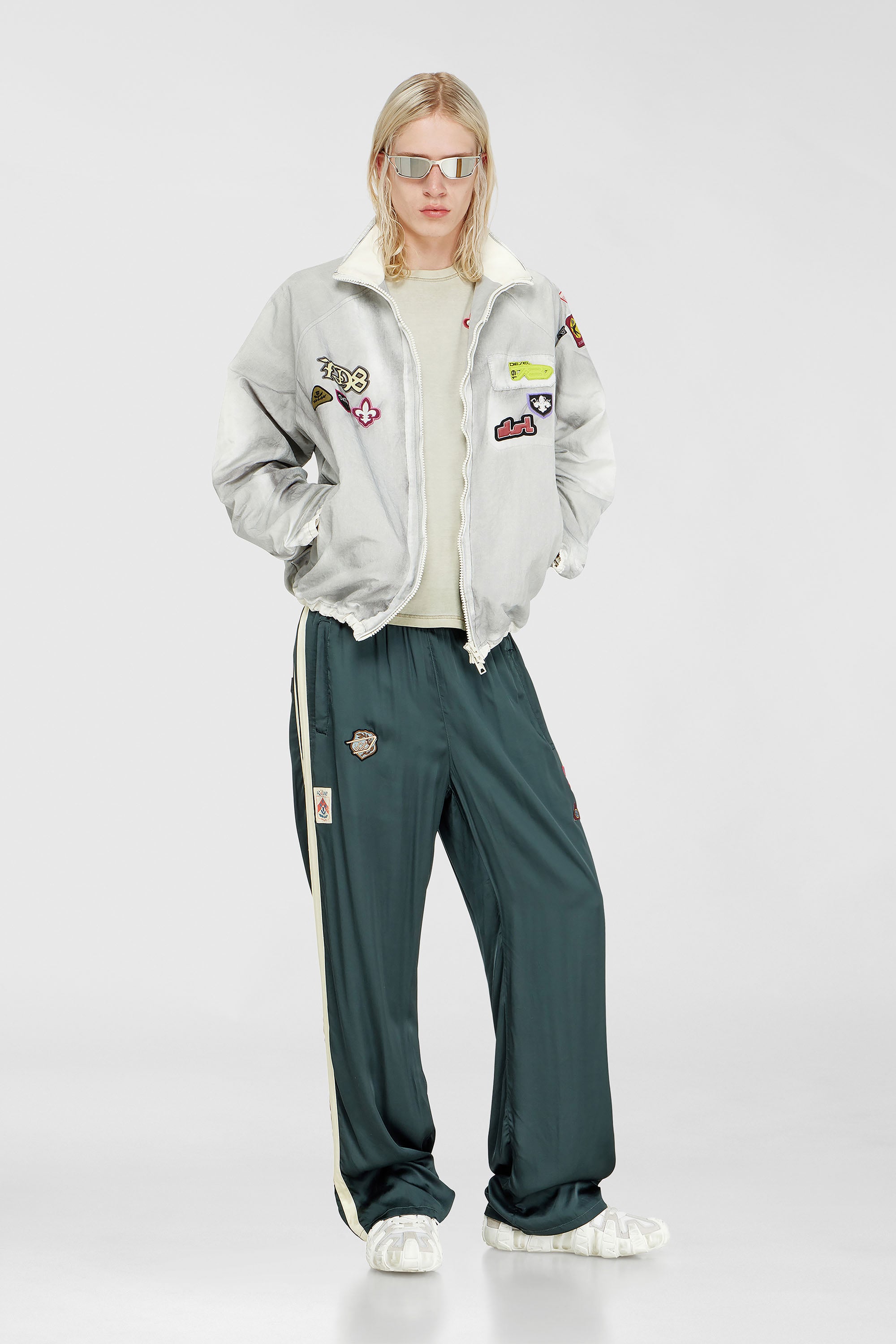Windbreaker with trompe l&rsquo;oeil patches